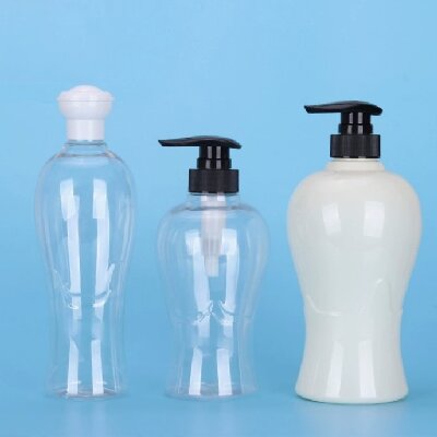 Transparent round plastic bottle for shampoo and bath products